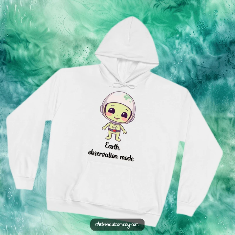 Funny hoodie with a smiling alien wearing a space helmet, observing planet Earth with a look of profound wonder.