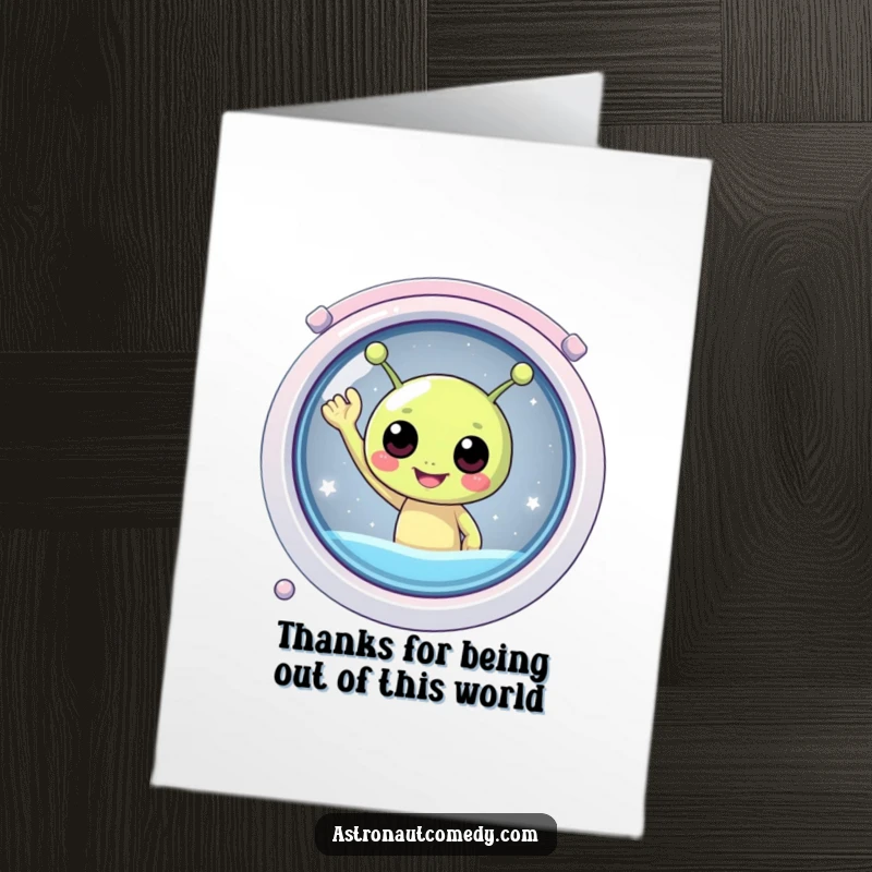 Funny Free Printable Thank You Card: a round, happy alien with antennae waving from a spaceship window, expressing thanks.