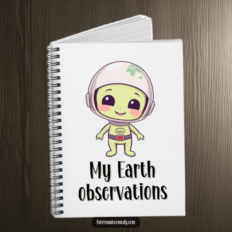 Funny notebook showing a smiling alien with a helmet gazing at planet Earth with a look of wonder, ideal for journaling.