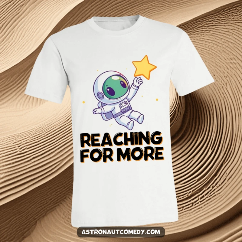 Funny t-shirt featuring a curious alien astronaut floating with joy in space, with one hand reaching out towards a bright star.