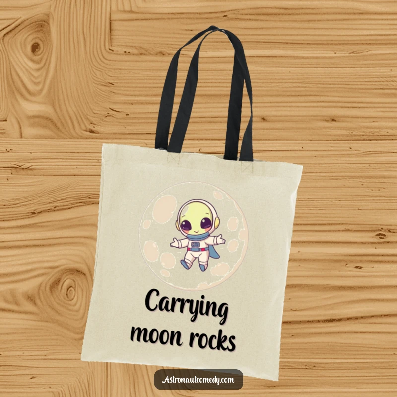 Funny tote bag with a beaming alien in a spacesuit happily bouncing high above the dusty surface of the moon.